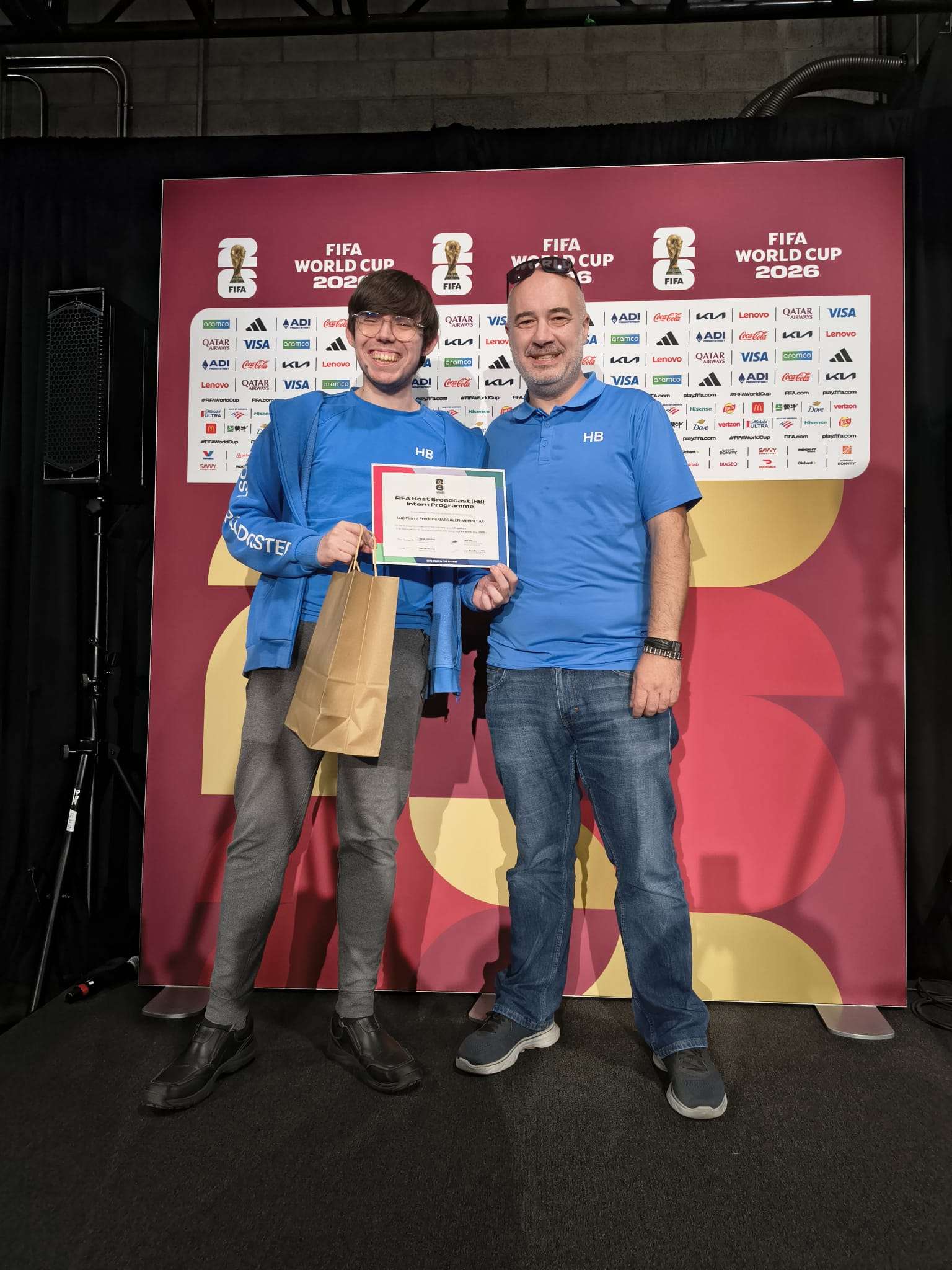 An image of a manager handing out a work certification